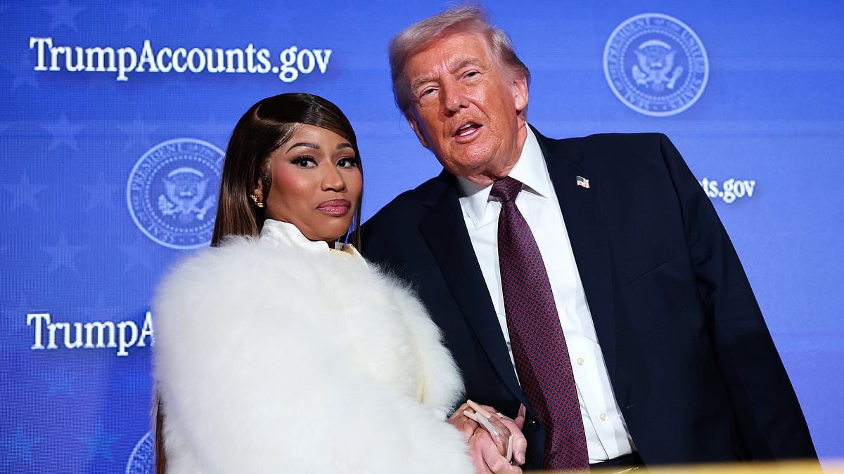 Careful she doesn't cut you, Donald! Nicki Minaj flashes dagger-long nails as she clutches Trump's hand after gushing she's his No. 1 fan