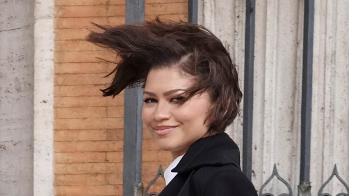 Windswept Zendaya shows off gold wedding band amid rumours she's married Tom Holland as she and Robert Pattinson continue to promote The Drama in Rome