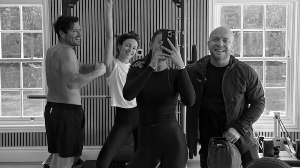 Michelle Keegan is put through her paces as she works up a sweat with shirtless husband Mark Wright and his sister Natalya in their lavish £3.5million Essex mansion