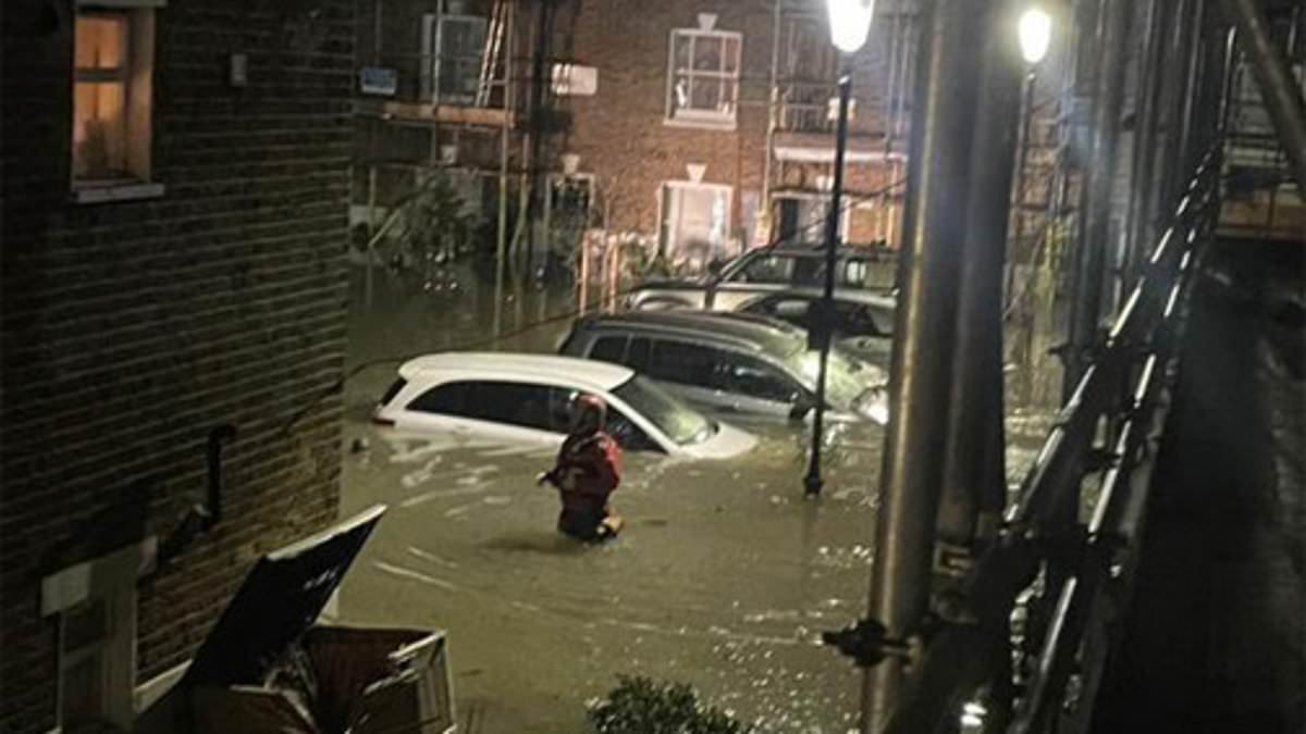 Holland Park flooding chaos as schools close and residents are rescued by dinghy when burst main cuts supply to thousands
