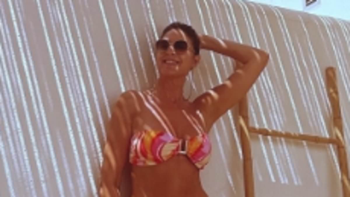 Lisa Snowdon, 54, shows off her age-defying figure in a patterned bikini as she enjoys a solo holiday in Spain