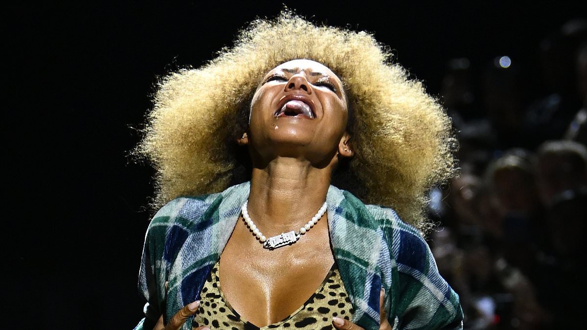Mel B flashes her leopard print bra as she walks the runway at the Natasha Zinko show during London Fashion Week