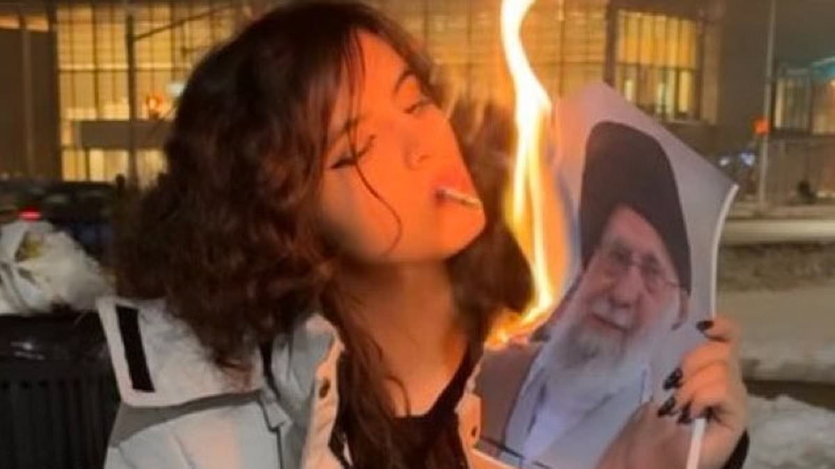 Iranian women light cigarettes by burning photos of Ayatollah Khamenei as protests to overthrow Supreme Leader grow and he activates 'missile cities' for defence