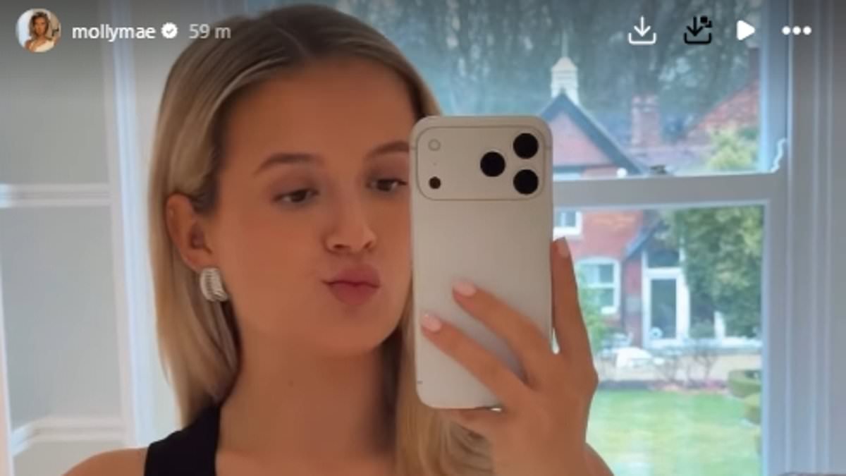 'So grateful to my body for carrying this baby': Pregnant Molly-Mae Hague shows off her bump in a tank top after revealing plans to have a boob job