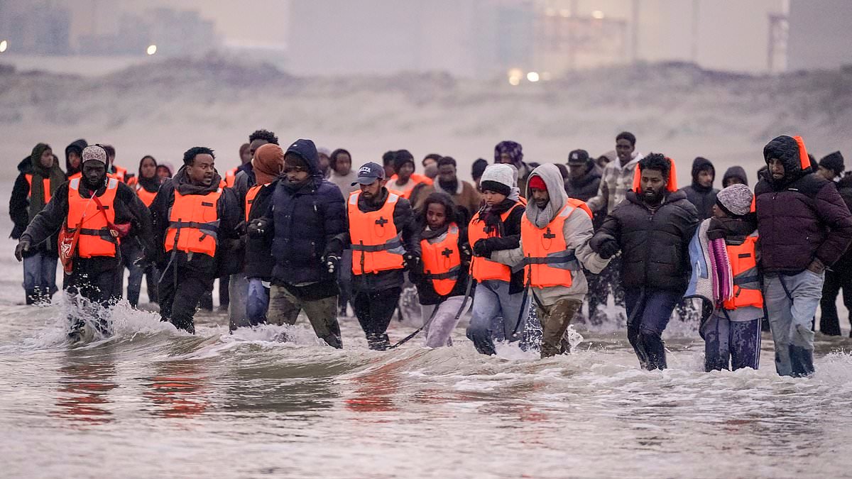 Boat packed with migrants crosses Channel as gendarmes look on - just days after border chief quit