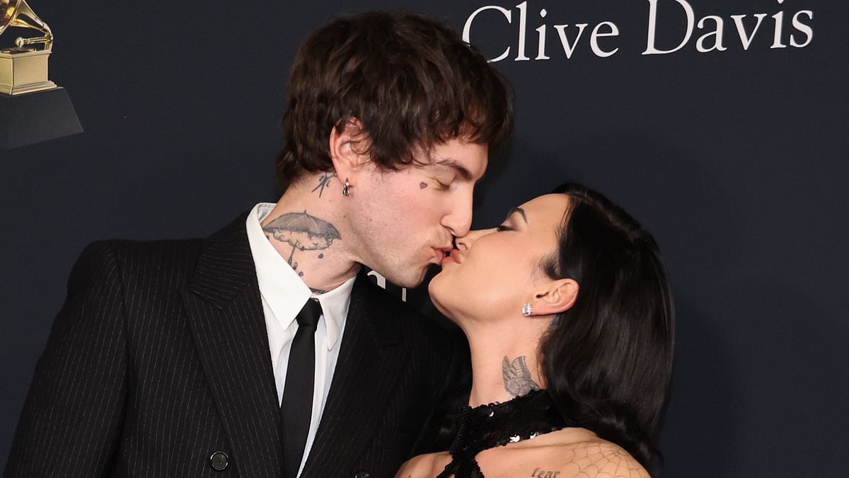 Demi Lovato shows off her 50lb weight loss in a plunging gown as she packs on the PDA with her husband Jutes at pre-Grammys gala