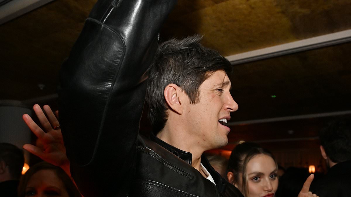 Vernon Kay parties hard at the BRITs as he hits the dancefloor with a cocktail in hand and snaps photos with the Gallaghers
