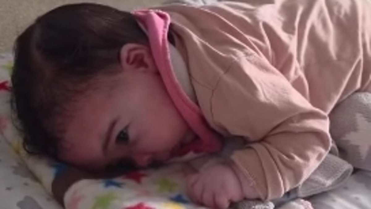 Jesy Nelson's ex-fiancé Zion Foster praises his 'little fighter' in sweet video of baby Story doing tummy time after devastating diagnosis