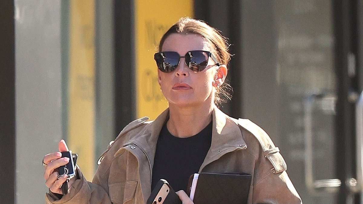 Coleen Rooney puts her wedding ring back on after husband Wayne was seen partying with two mystery women in Manchester