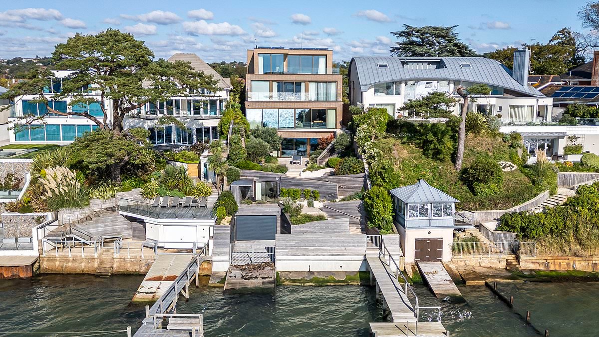 Multimillionaire is forced to downsize plans for his £8.8million Sandbanks mansion after bid to make it the tallest house on street