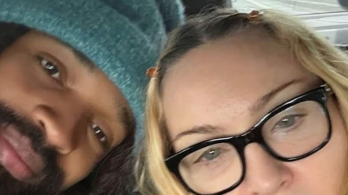 Madonna, 67, snaps selfies with boyfriend Akeem Morris, 29, and takes her 'second Uber ever' to watch Tottenham - after attending her daughters' Spurs Academy match
