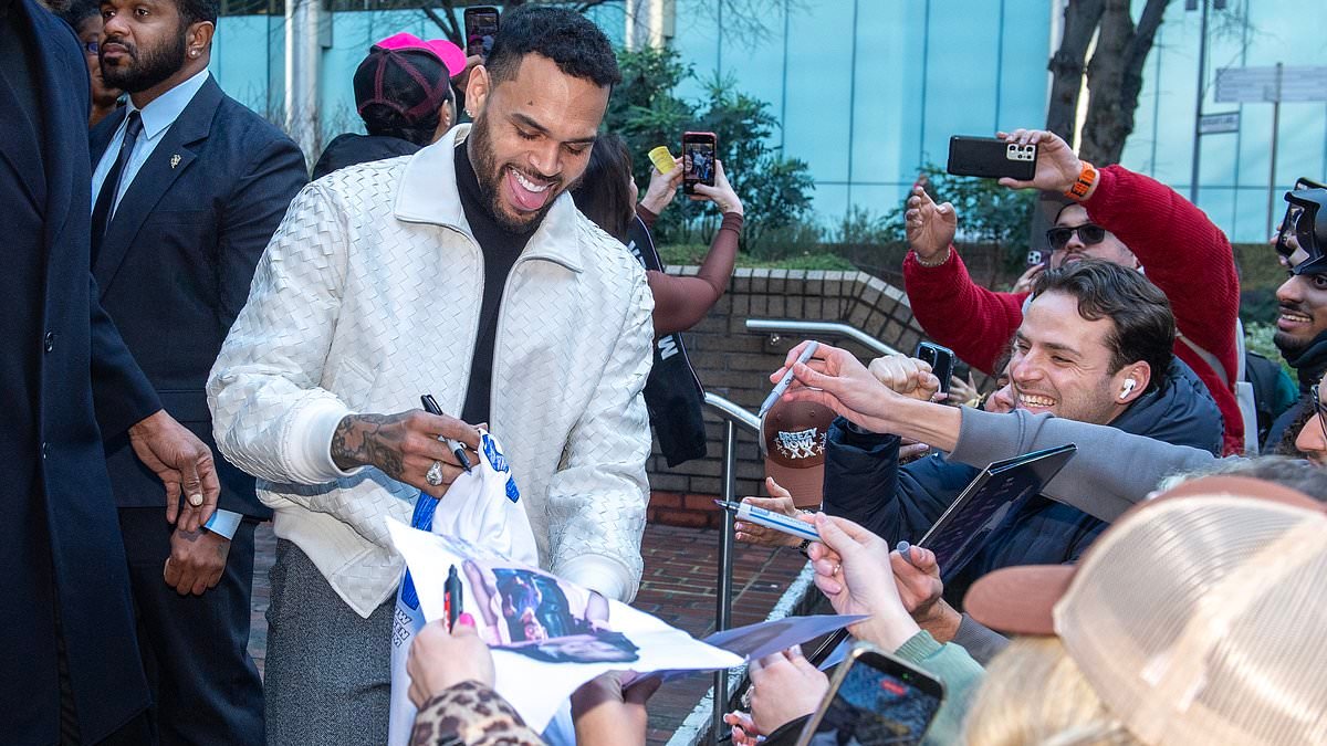 Chris Brown appears in court over alleged tequila bottle attack on music promoter at London nightclub - before signing autographs for fans as he leaves hearing