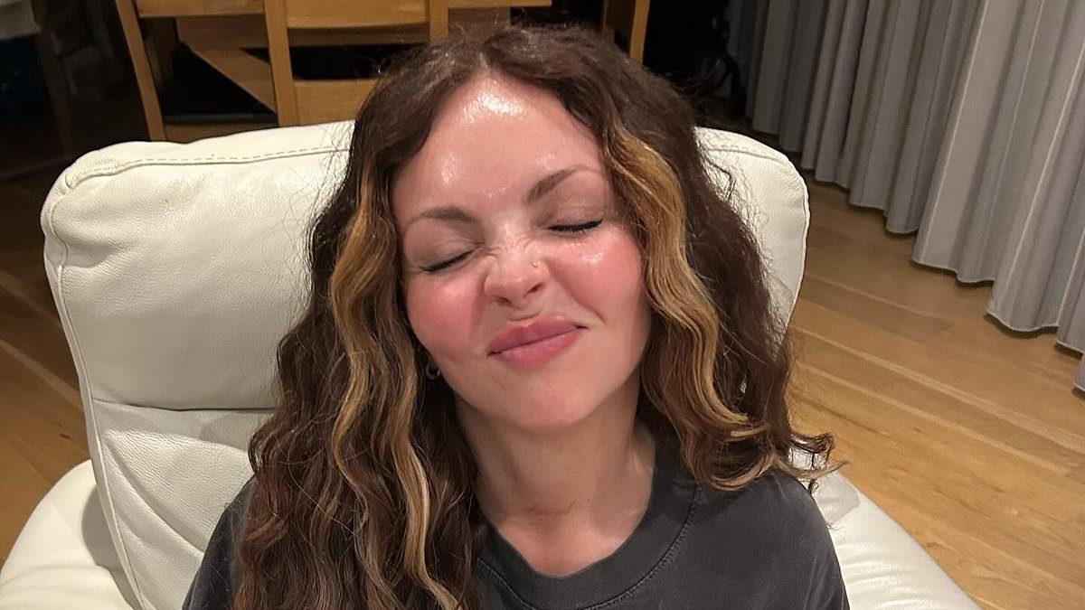 Jesy Nelson shares a sweet video of her baby girl laughing as she plants a kiss on her forehead - amid the twins' devastating health battle