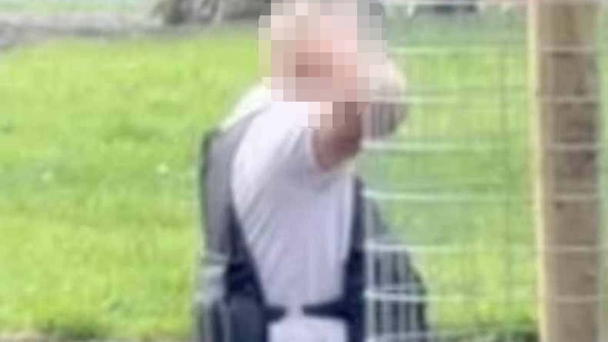 Armed police swoop on man feared to be wearing suicide belt...before discovering it's a weighted gym top