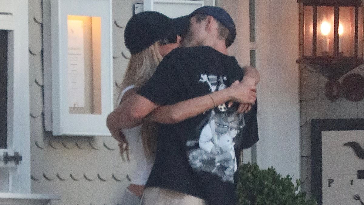 Brooks Nader devours Taron Egerton as unlikely couple make romance official with steamy PDA session