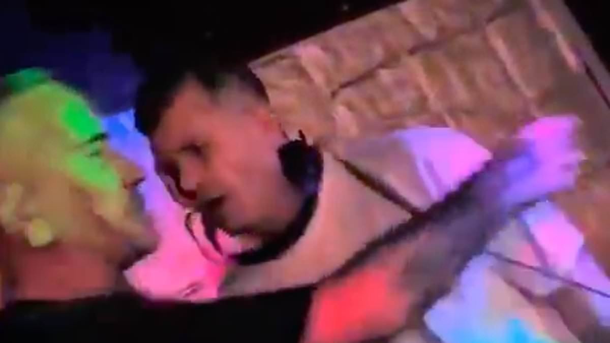 Moment DJ is punched unconscious by another disc jockey at leisure centre 'nightclub' as he tried to finish his set