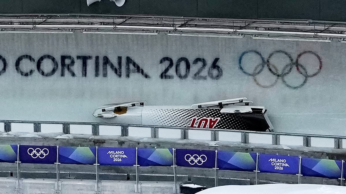 Bobsleigh driver hospitalised at Winter Olympics after terrifying crash during four-man final - with event delayed by over 20 minutes while he received urgent medical attention