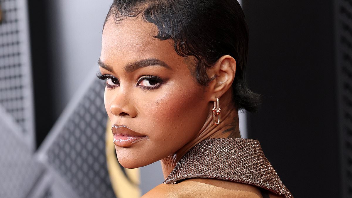 Teyana Taylor flaunts her incredible abs in a wild plunging dress with a $33,000 necklace as she hits the Grammy Awards amid Oscars buzz