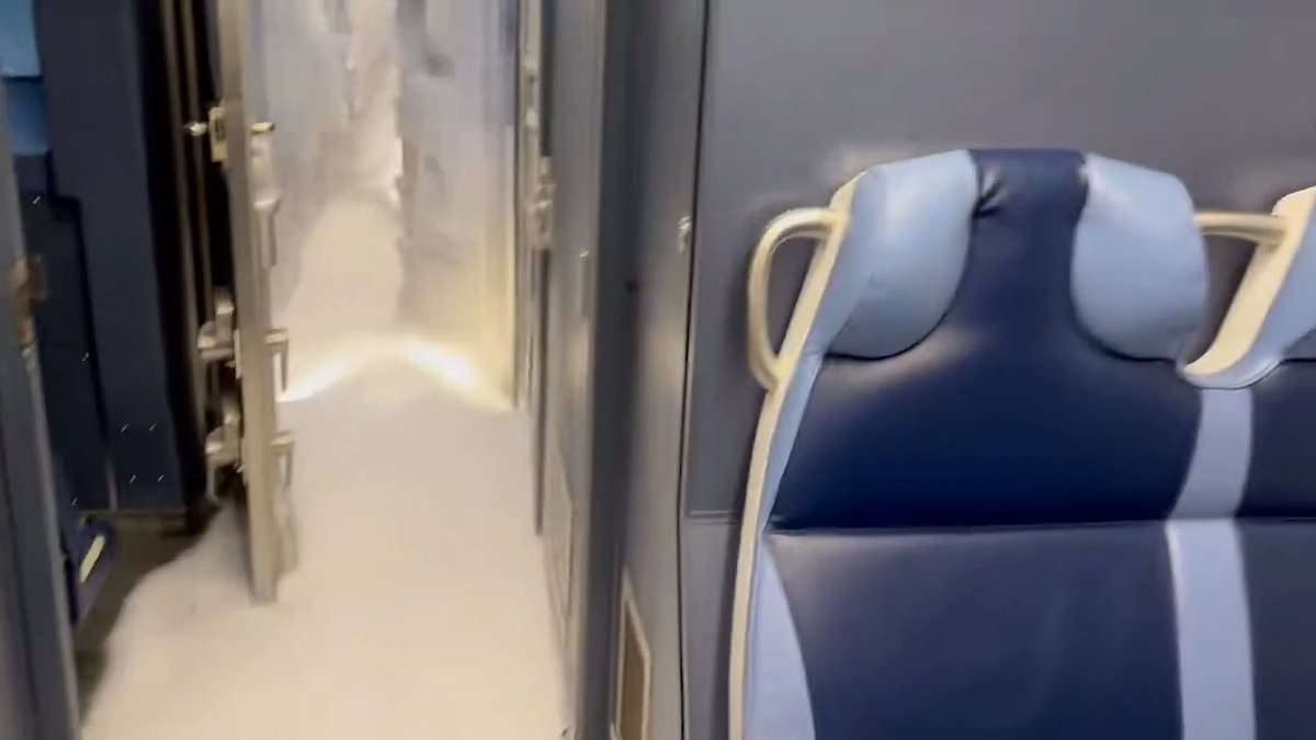 Eerie moment train is filled with SNOW as historic winter storm cancels another 4,000 flights: Live updates