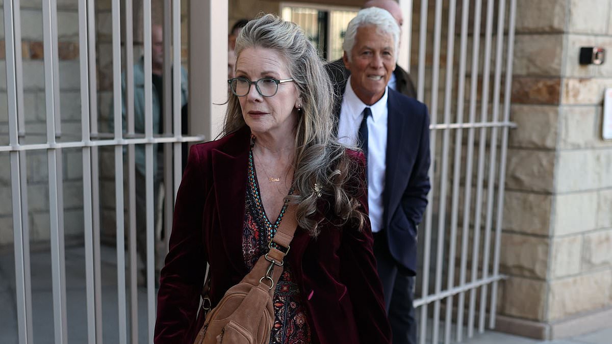 Stone-faced Melissa Gilbert arrives at court as she stands by husband Timothy Busfield over child sex charges