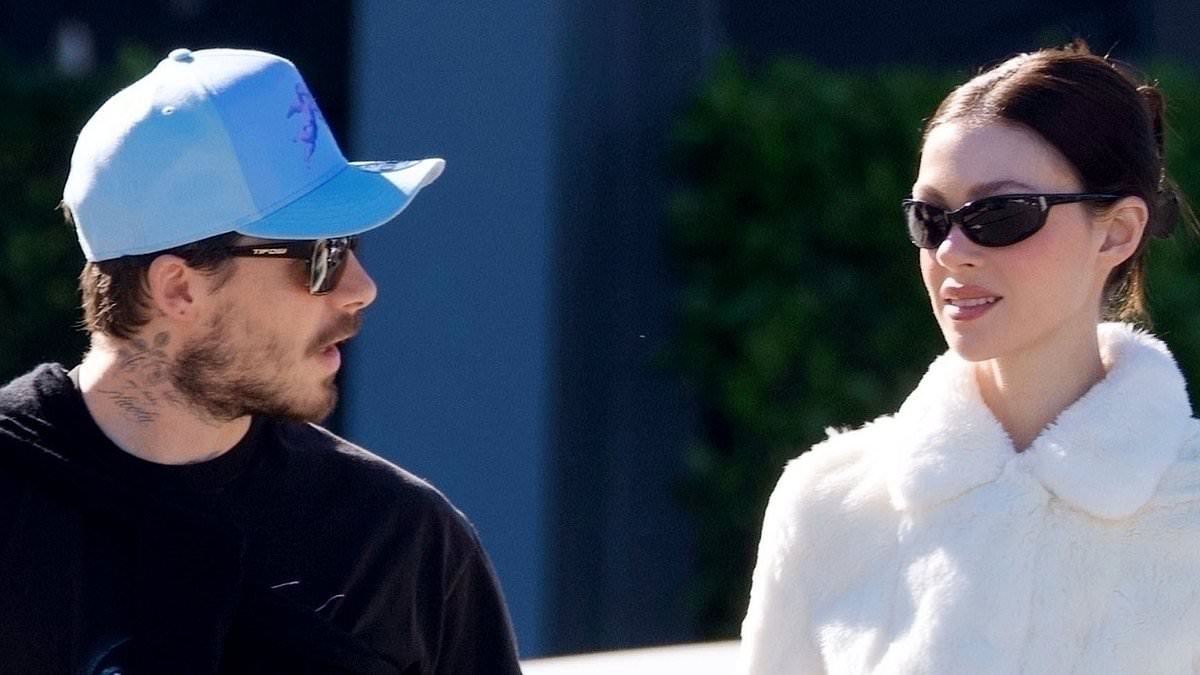 Brooklyn Beckham and Nicola Peltz look smitten as they hold hands at their local farmers' market after the reason he sent a legal letter to estranged parents David and Victoria was 'revealed'