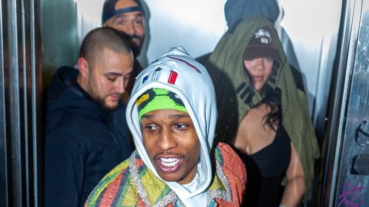 Rihanna slips into a plunging black ruche dress as she enjoys a night out with boyfriend A$AP Rocky in Paris during Fashion Week