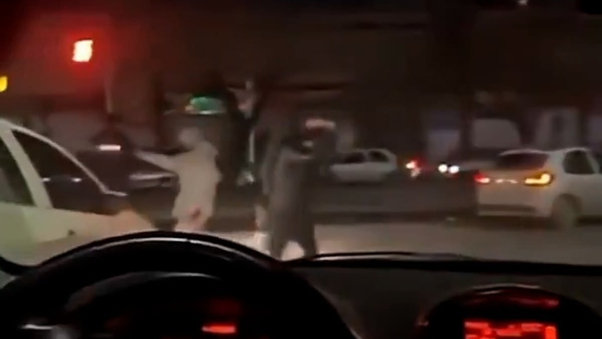 Moment Iranian forces open fire on anti-government protesters as Donald Trump warns the regime he will protect demonstrators if violence continues - while Tehran warns US bases will be a 'legitimate targets' if it gets involved