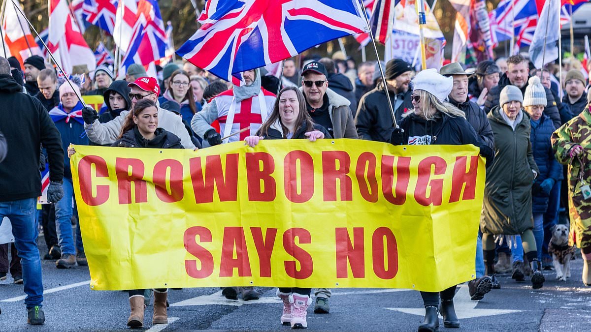 Protesters clash with police as hundreds march against plans to house 600 migrants in former army barracks
