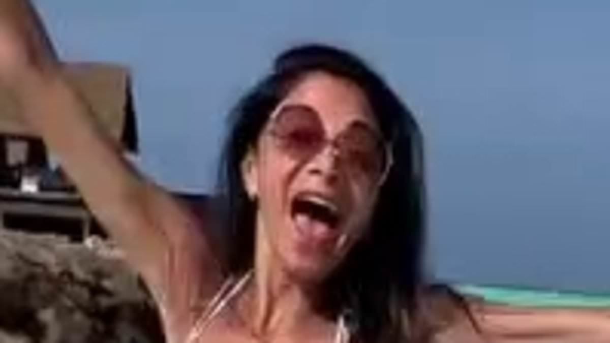 Nicole Scherzinger, 47, shows off her incredible figure in a blue bikini as she packs on the PDA with fiancé Thom Evans, 40, at £2,700-a-night resort in the Maldives