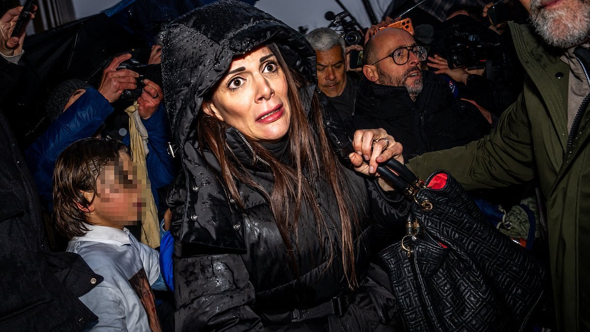 Furious families ATTACK owners of Swiss inferno nightclub where youngsters burned to death: Terror is etched on female manager's face as parents scream 'you killed my son - you'll pay for this'