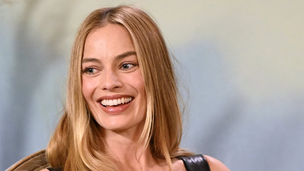 Margot Robbie turns heads in a leather corset mini dress as she continues to promote Wuthering Heights