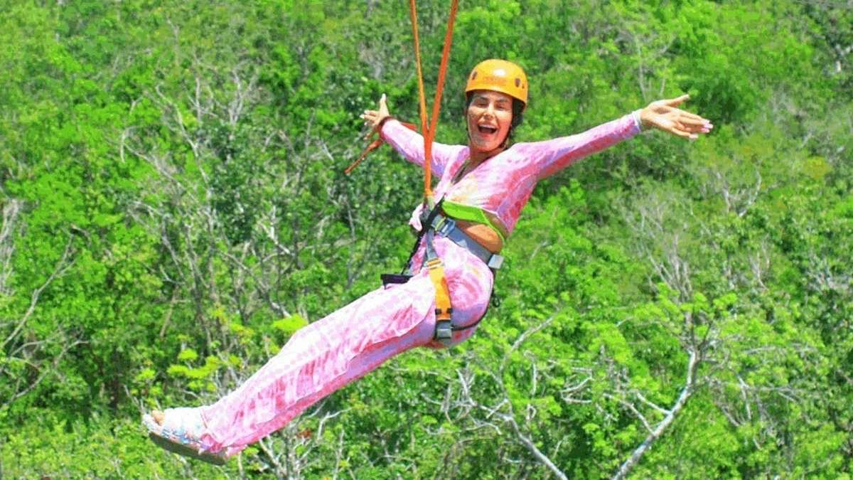 Benefits cheat who swindled £23,000 in handouts after claiming she was housebound with anxiety is caught clubbing, ziplining and surfing during family holiday to Cancun