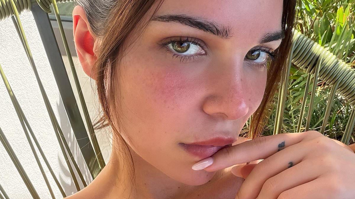 Cruz Beckham's girlfriend Jackie Apostel sizzles in a green strapless bikini as she soaks up the sun in Miami after the singer made a racy confession about their sex life