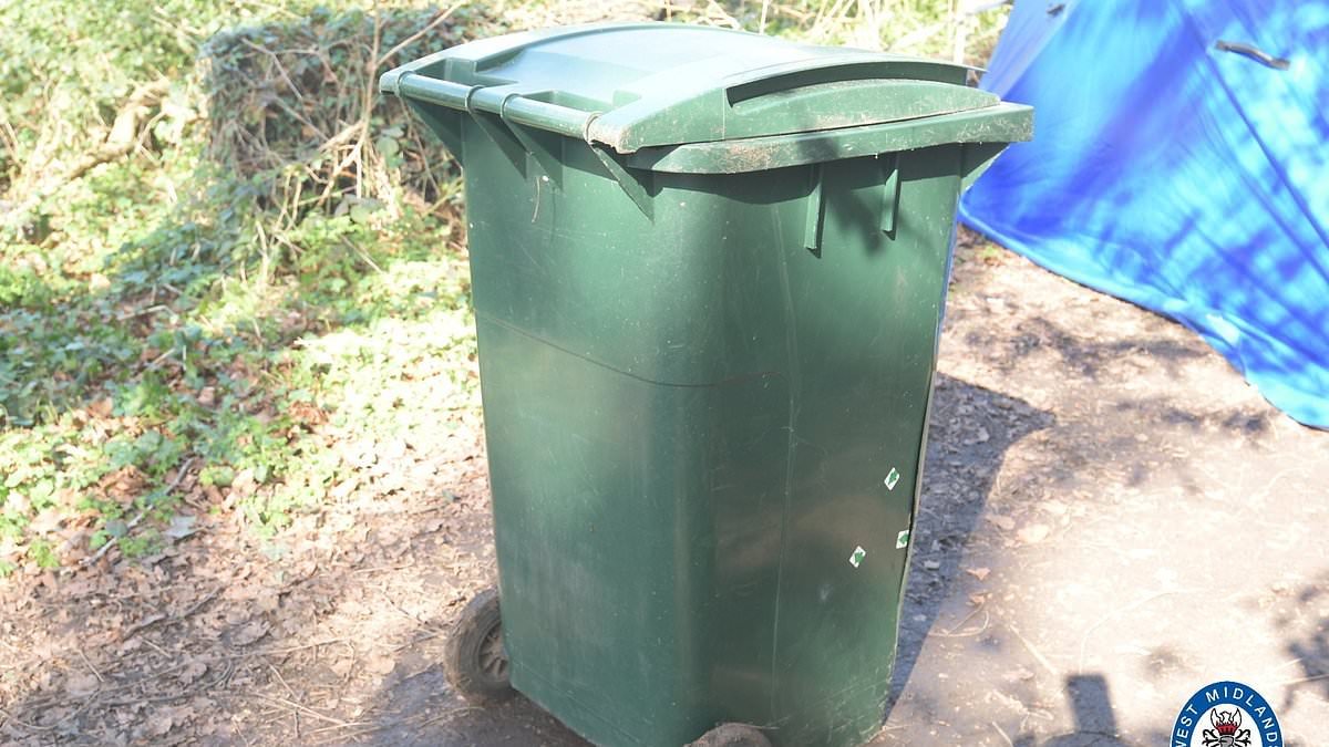 Two men and a woman are arrested after a man was found dead inside a wheelie bin who 'may have been hit by a vehicle'