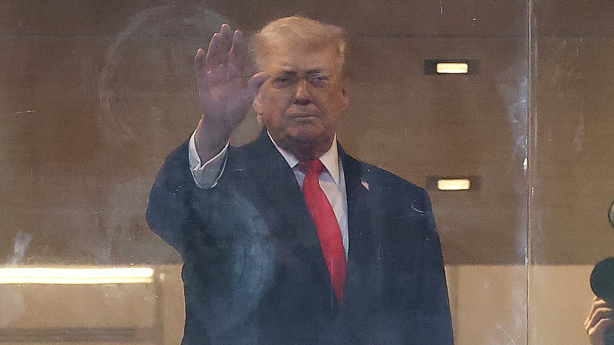 Trump enjoys family night out with Ivanka and Kai at college football playoff final as he gets raucous reception from fans in Miami