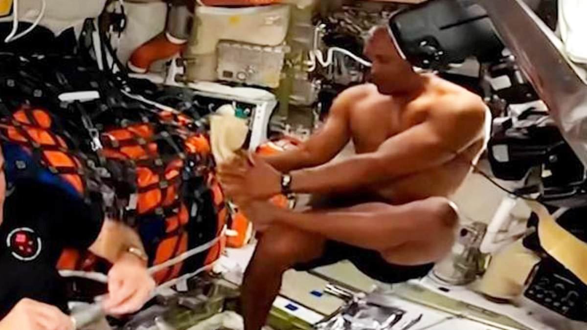It's one giant treat for womankind as musclebound astronaut Victor Glover is caught on camera taking a post-workout 'space shower'