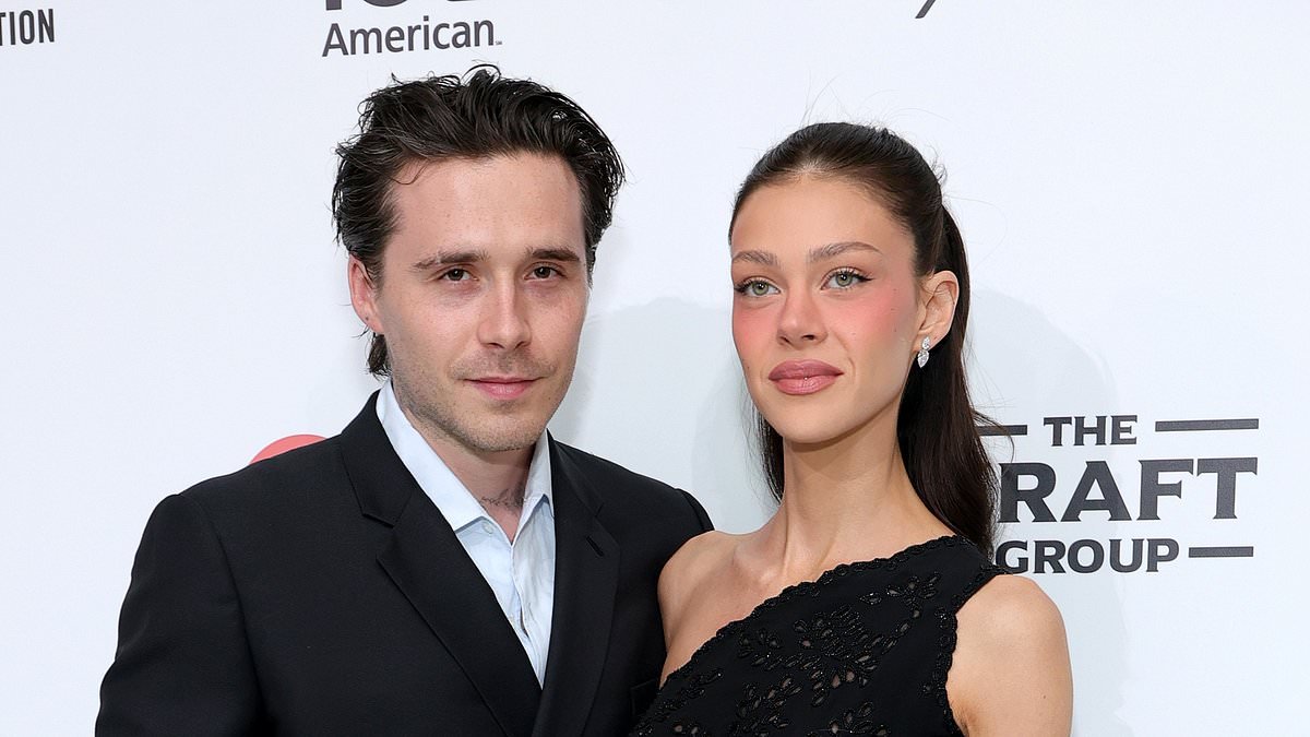 Brooklyn Beckham cosies up to his wife Nicola Peltz as they attend his godfather Elton John's Oscars viewing party after brutal Mother's Day snub