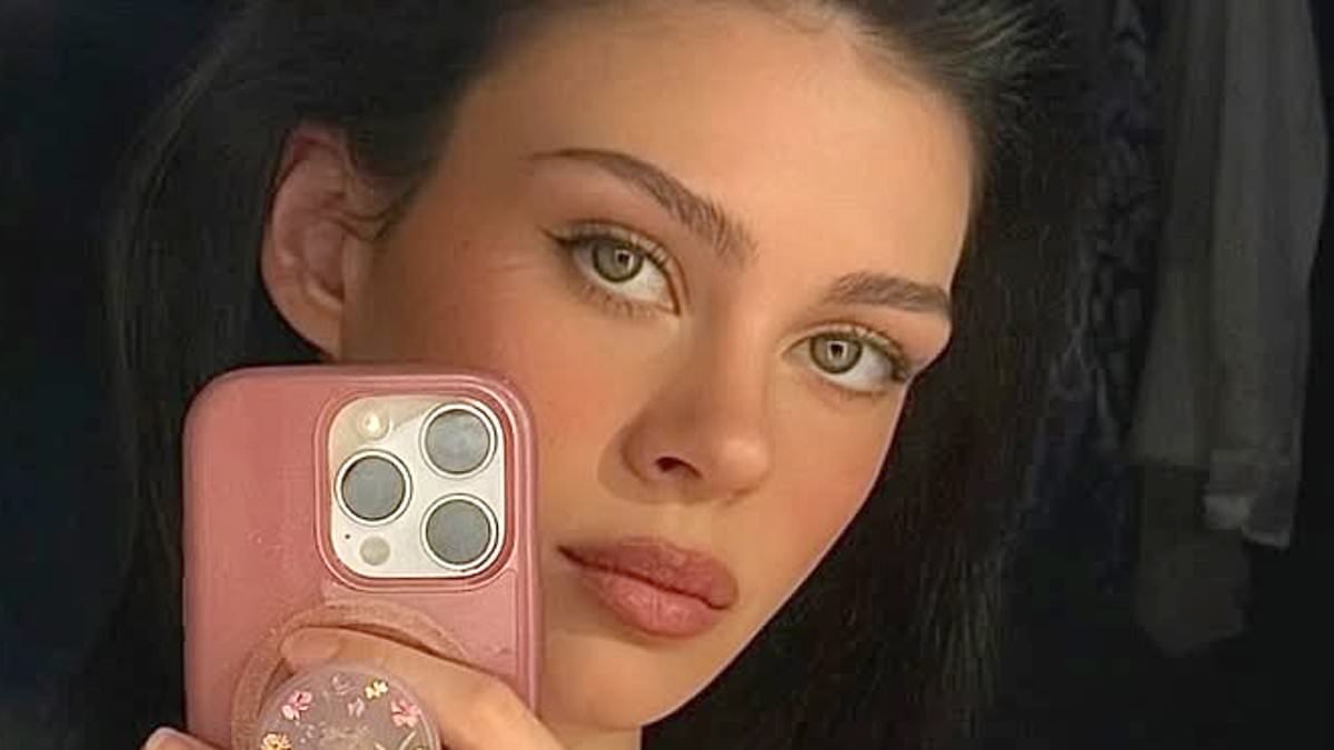 Bikini-clad Nicola Peltz shares poignant message for the Beckhams with 'family first' tattoo amid feud after it emerged she's grown 'obsessed' with driving the rift