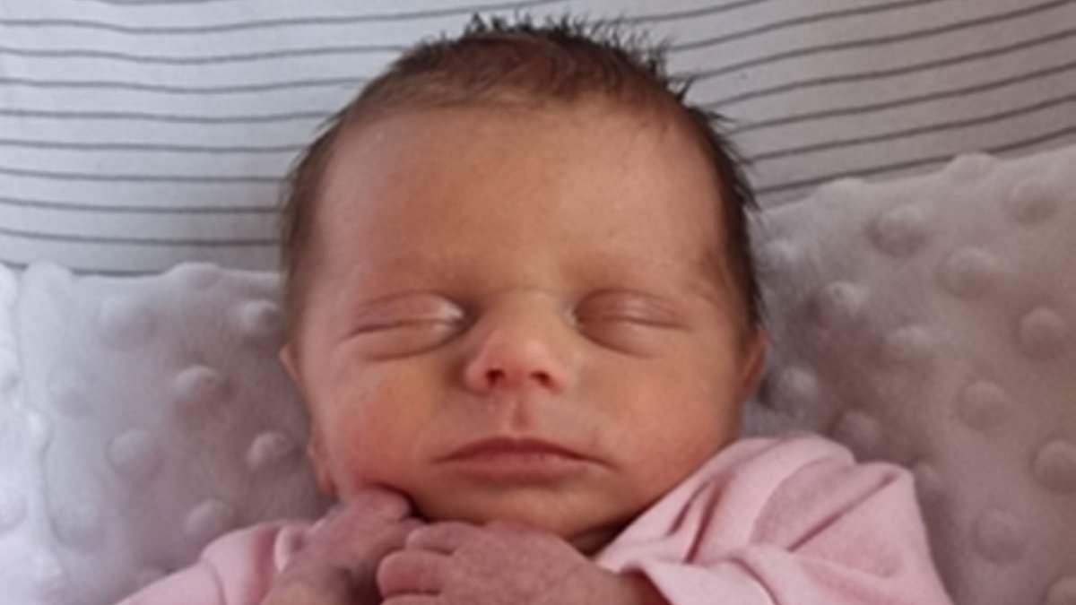 Moment baby-killing father moans that his handcuffs are 'too tight' as he is arrested for murdering his five-week-old daughter
