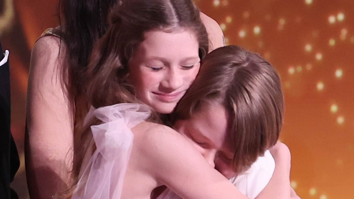 Hamnet wins Outstanding British Film as child actors Jacobi Jupe and Olivia Lynes sweetly hug on stage