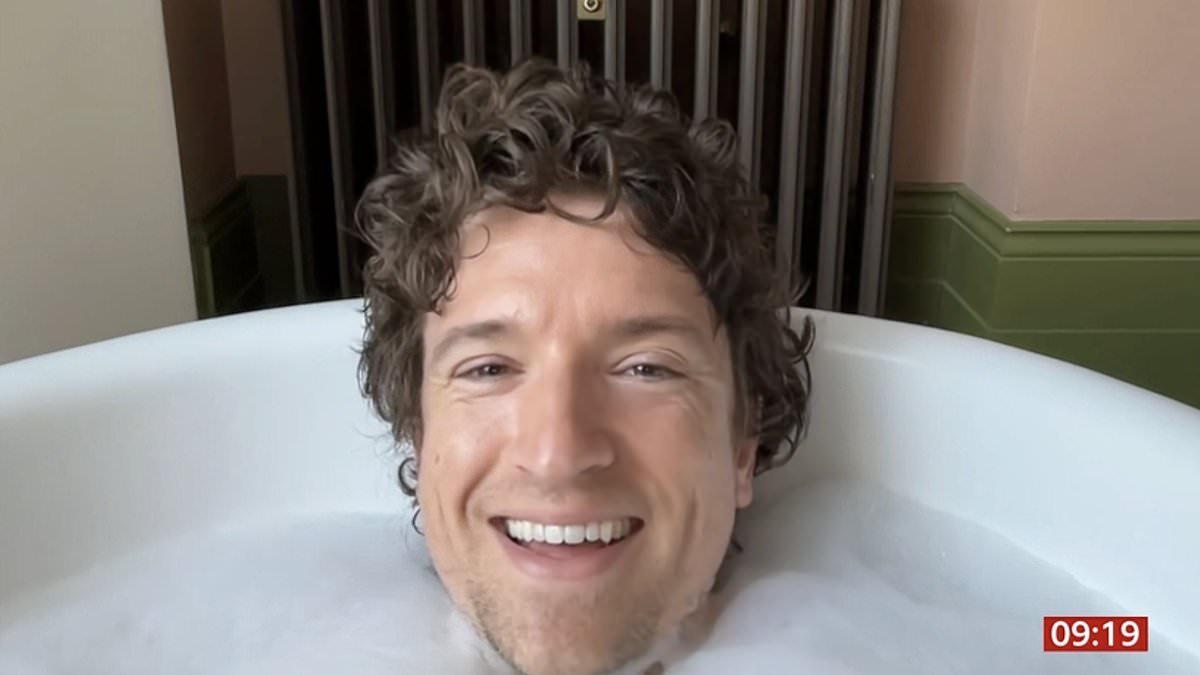 Greg James recovers from incredible 1000km Comic Relief bike challenge with a soak in a bath LIVE on BBC Breakfast - after raising £4million for charity