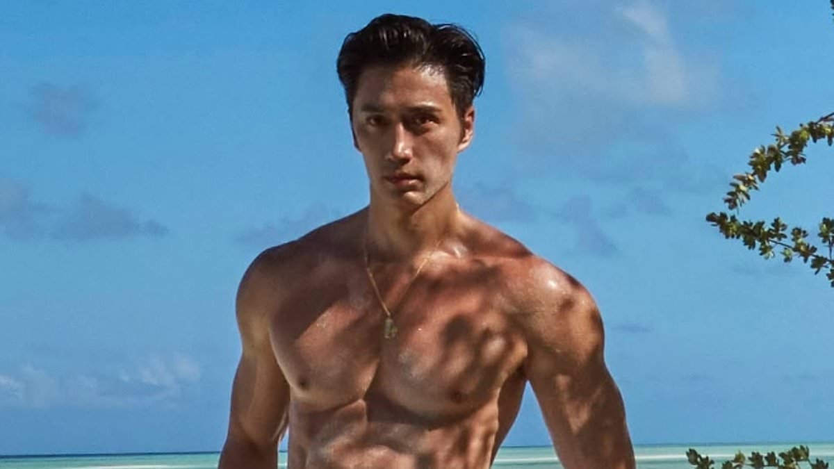 This photographer has been called the 'real life Dorian Gray' for his age defying looks - but can YOU guess how old he is?