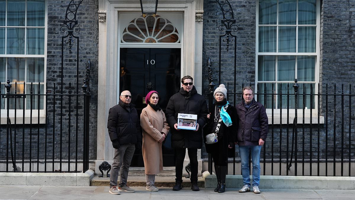 Family of British couple detained in Iran on espionage charges urge Government to 'come out and defend their citizens' as they deliver petition to Downing Street