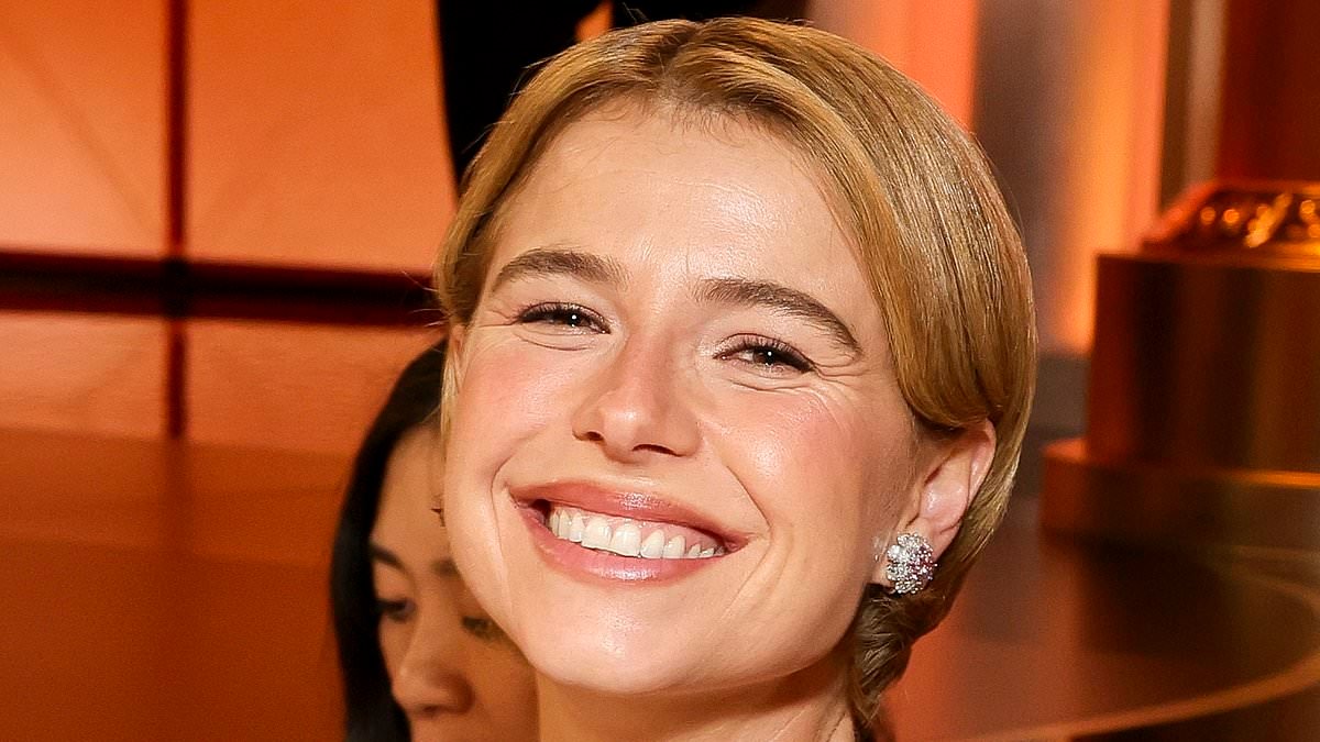 Updates from the babysitter? Golden Globe winner Jessie Buckley's baby girl flashes up on her phone as she enjoys a child-free night out