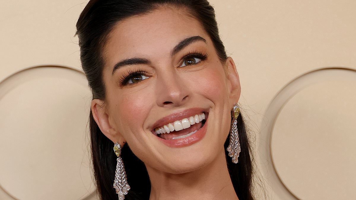 Anne Hathaway's changing face: How star looks younger at 43 than she did in her 20s - as expert reveals the secrets behind her youthful glow