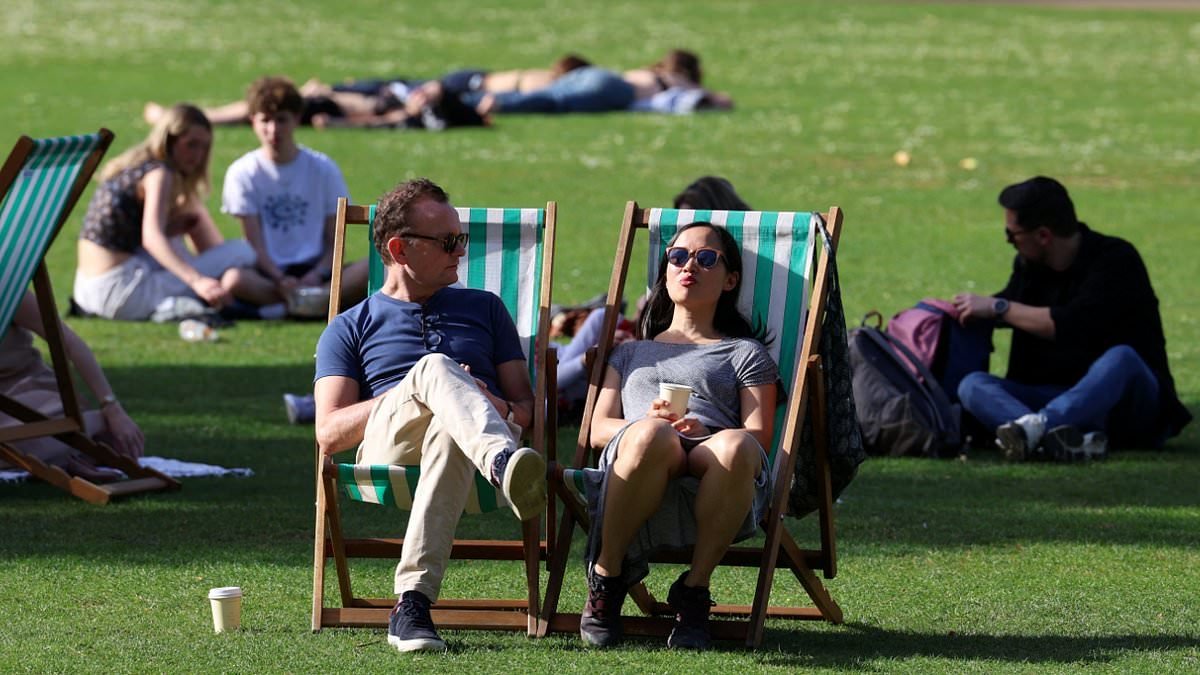 Britain basks in the hottest day of the year: Sun-seekers packed out parks and beaches as mercury hit 26.5C to make it one of the warmest April days on record