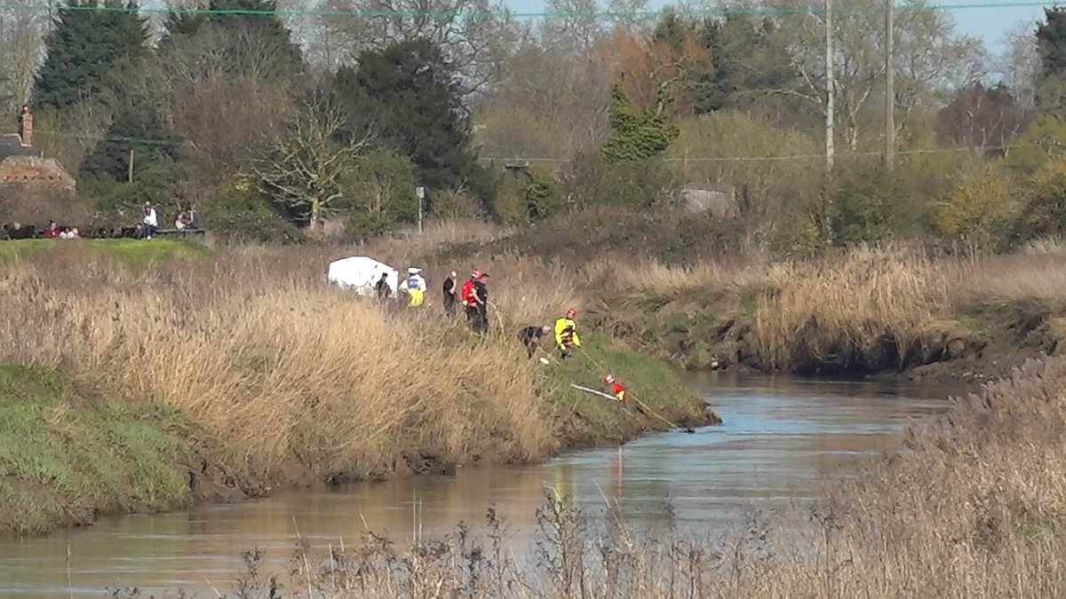 Body of girl found in hunt for two missing teenagers after car plunged into river
