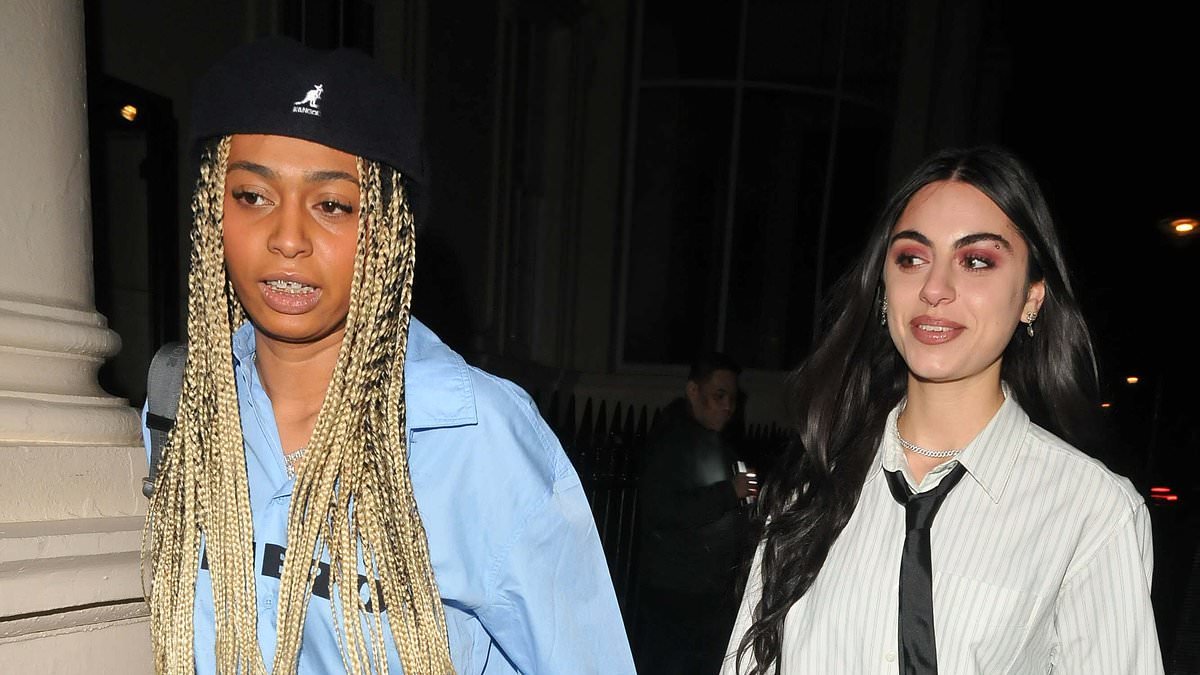 Mel B's daughter Phoenix Chi Brown, 26, holds hands with a friend as they attend Maison Perrier event