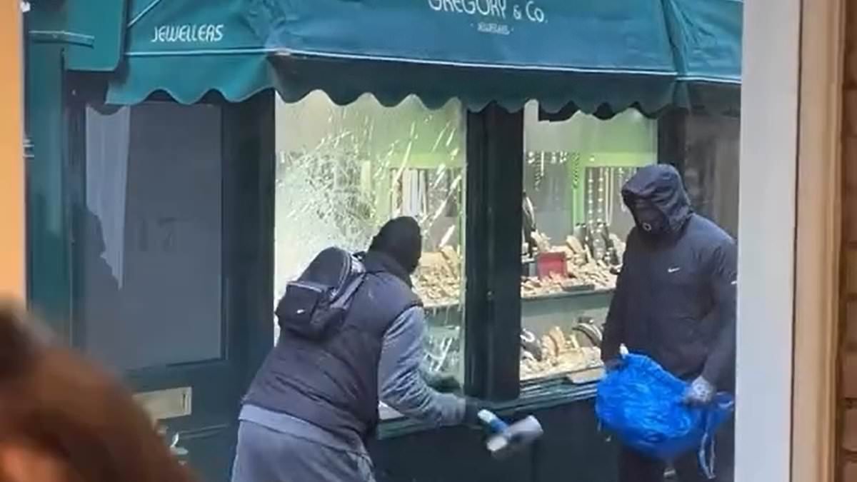 Family jewellers targeted by sledgehammer-wielding robbers in terrifying daylight raid vow to reopen and thank 'overwhelming' public support as police find getaway car