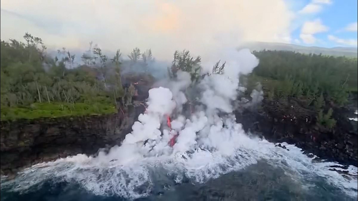 Moment lava from volcano on French island reaches the ocean for the first time in years